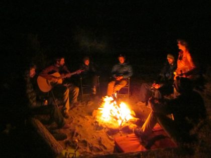 Campfire at night with guitar