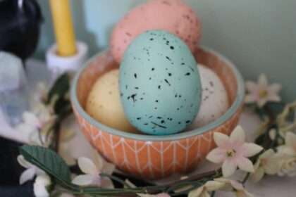 Bowl of speckled eggs with flowers
